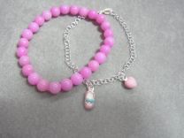 Setje van 2 zilveren kinderarmbandjes met roze bedeltjes